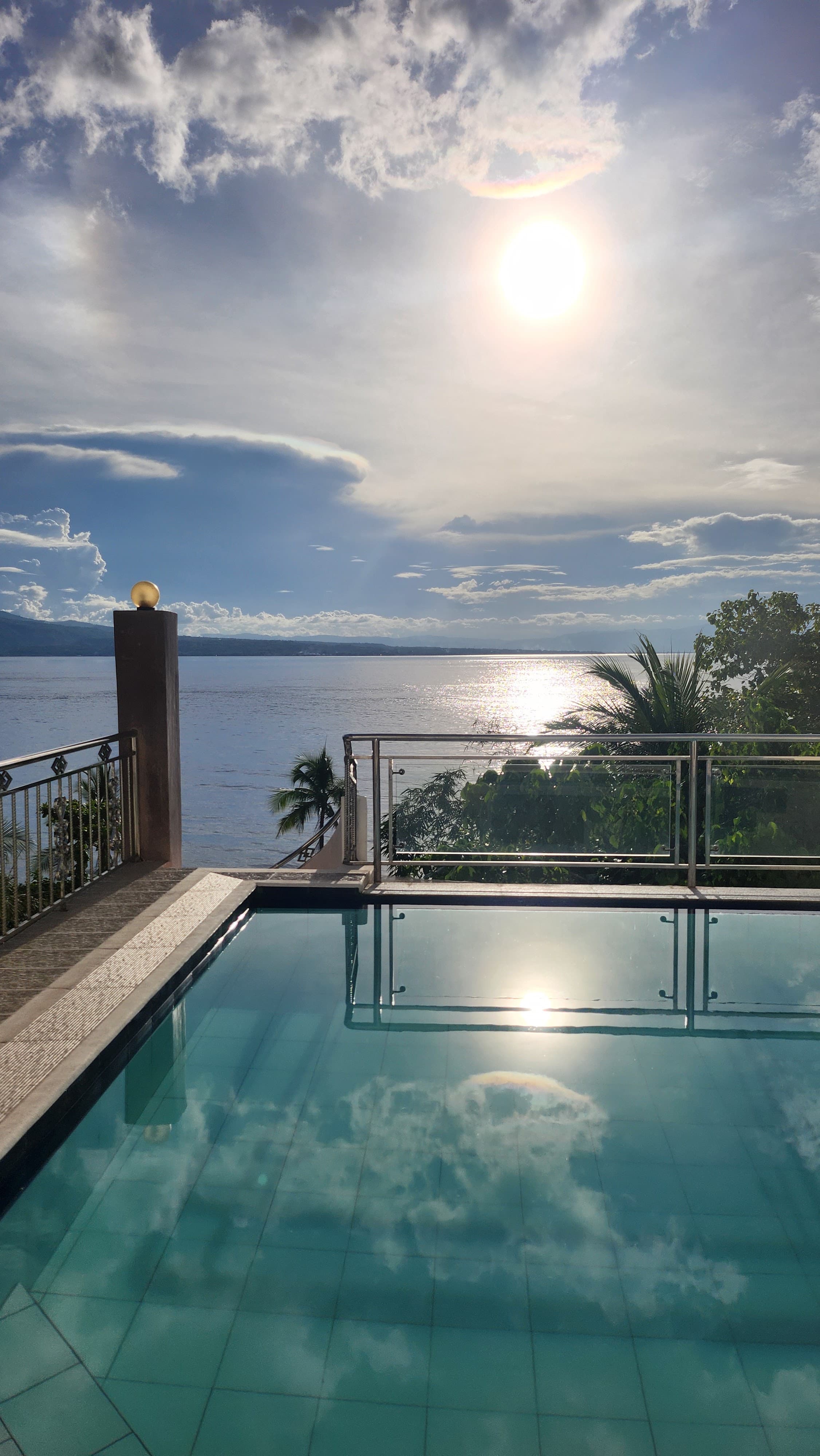 The infinity pool at Tañon Strait Resort at sunset